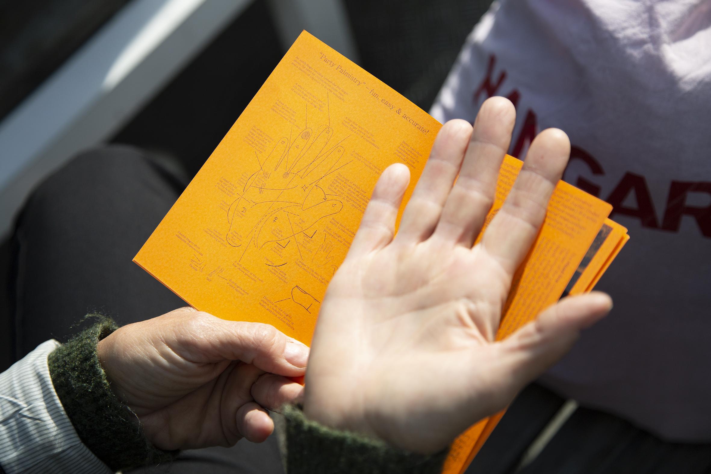 A hand and a leaflet.