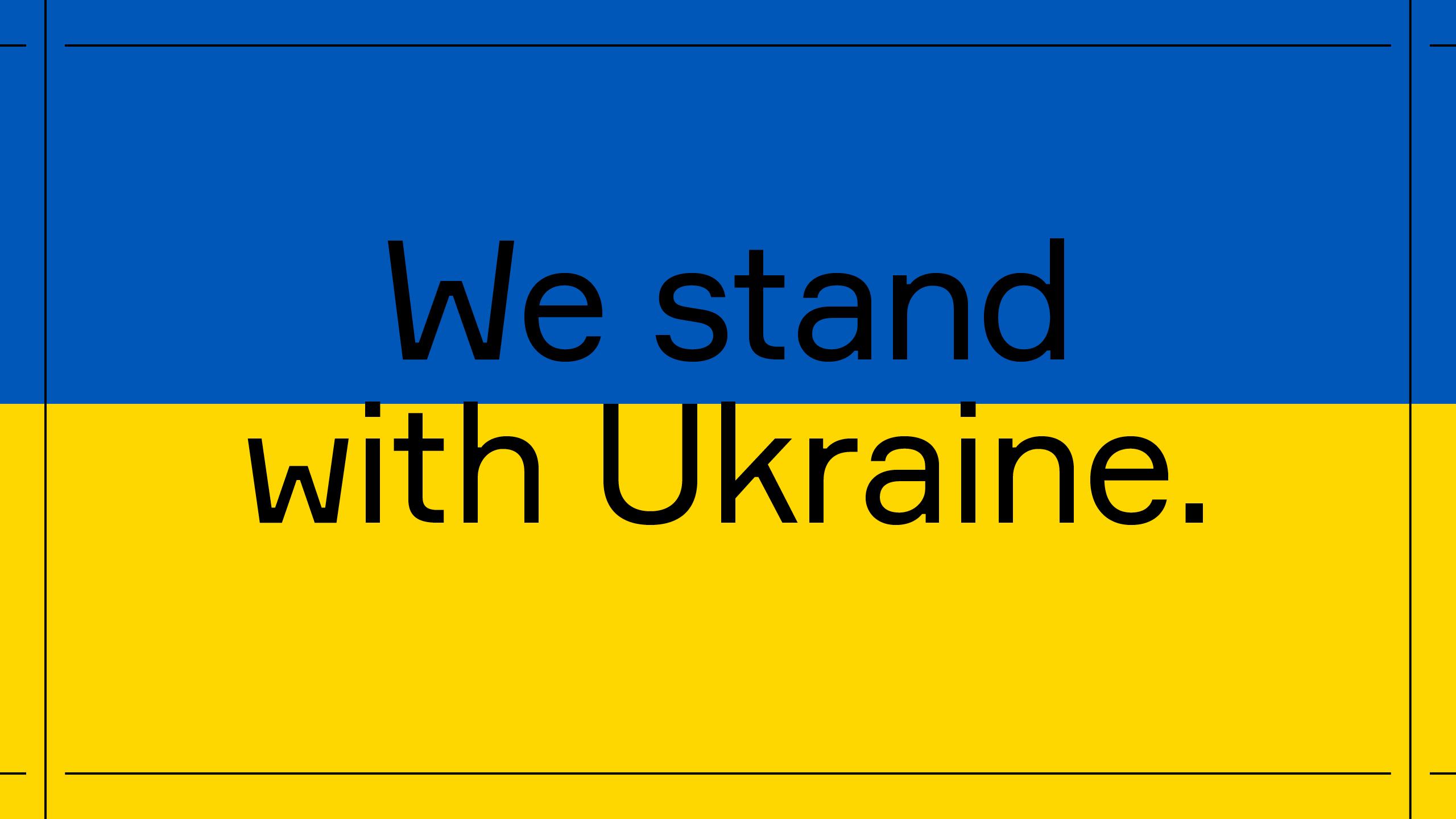 Ukrainian flag colours, blue and yellow, with the text 'We stand with Ukraine'