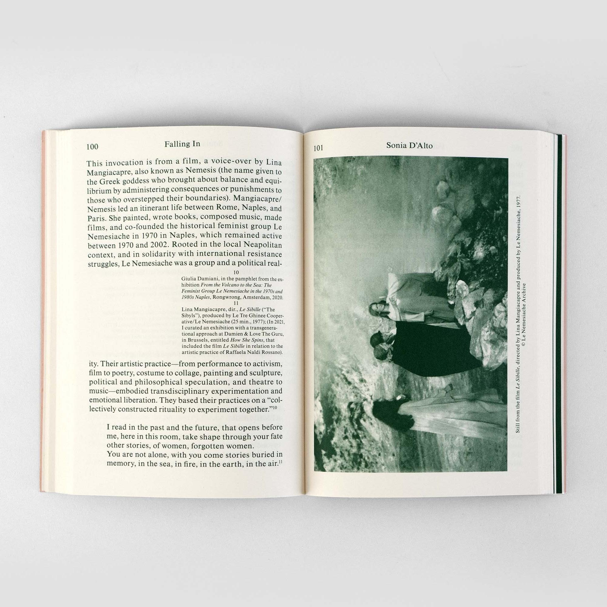 A book spread with text and an image of women in capes.